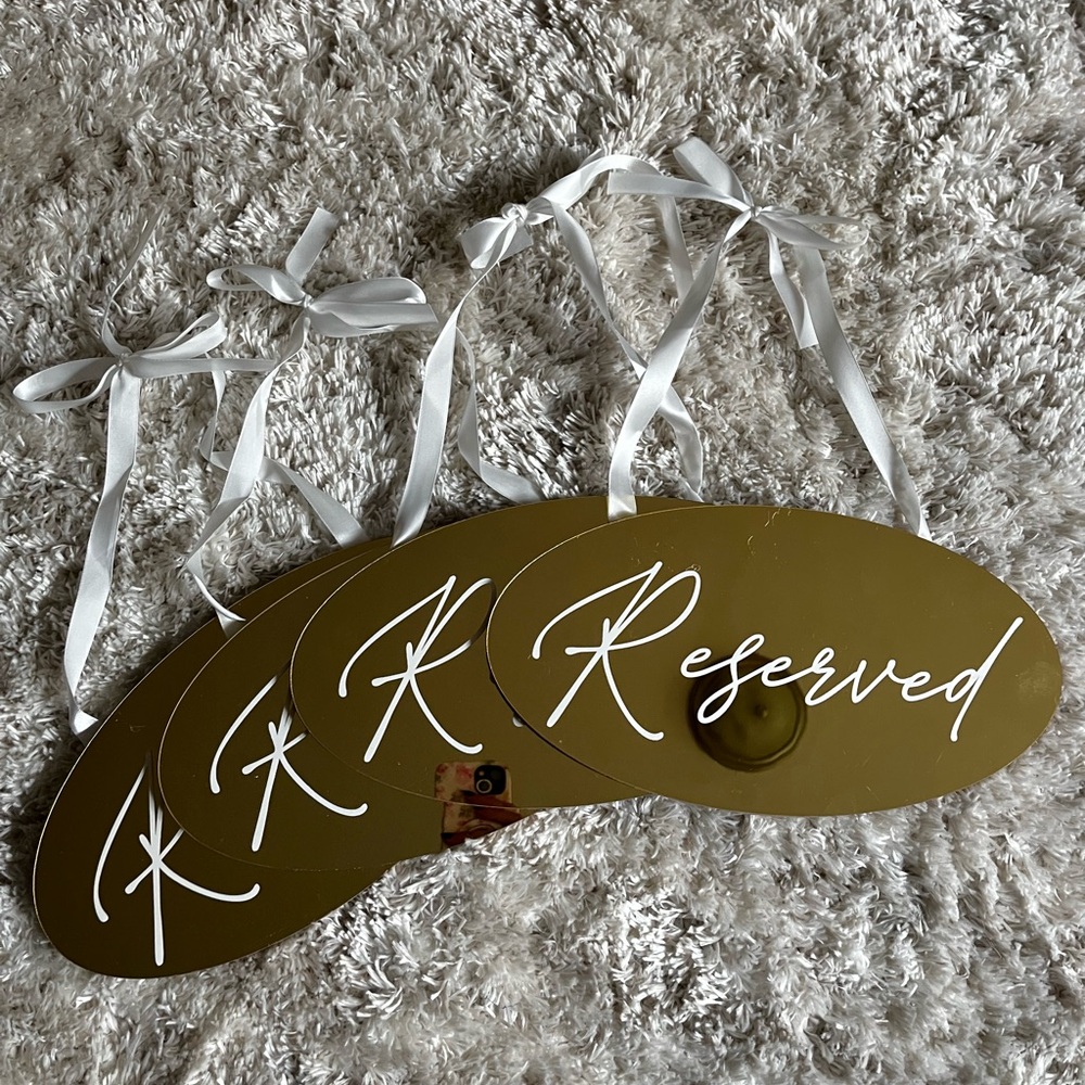Gold Reserved Signs with White Ribbon
